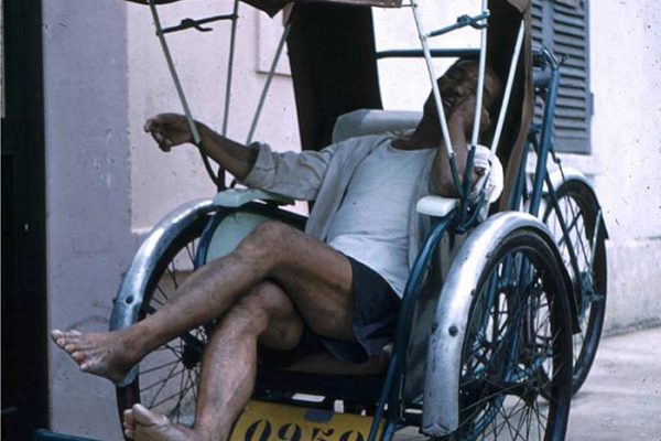 saigon-1961---rickshaw-driver-asleep-in-his-cab_14438918202_o