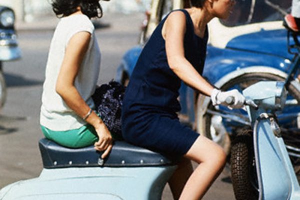05 Dec 1967, Saigon, South Vietnam --- Young women--most of them dressed in Western styles, stroll through downtown streets in Saigon. --- Image by © Bettmann/CORBIS