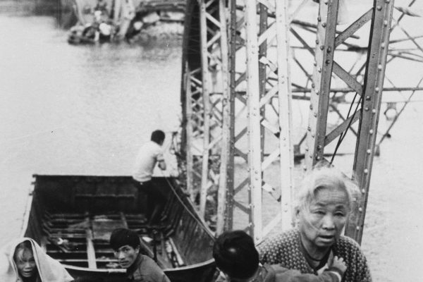 https://www.docsteach.org/documents/document/flee-tet-offensive

The old and the young flee Tet offensive fighting in Hue, managing to reach the south shore of the Perfume River despite this blown bridge; 1968