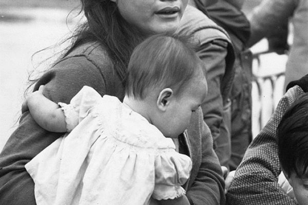 19th February 1968:  Vietnamese woman and baby, two of the refugees crossing the 'Perfume River' during the Vietnam war.  (Photo by Terry Fincher/Express/Getty Images)