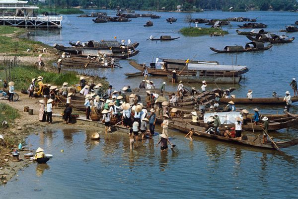 Hue, South Vietnam --- Makeshift ferries- sampans lashed together- carry:Bettmann Aresidents across ry: perfume r:19r which bisects ry: city. --- Image by © Bettmann/CORBIS