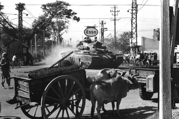 Tank from 1st Bn., 69th Armor, 25th Inf. Div., moves through Saigon shortly after disembarking from LST at Saigon Harbor, March 12, 1966.  SP/5 Park, USA.  (USIA)
NARA FILE #:  306-MVP-25-1
WAR & CONFLICT BOOK #:  419