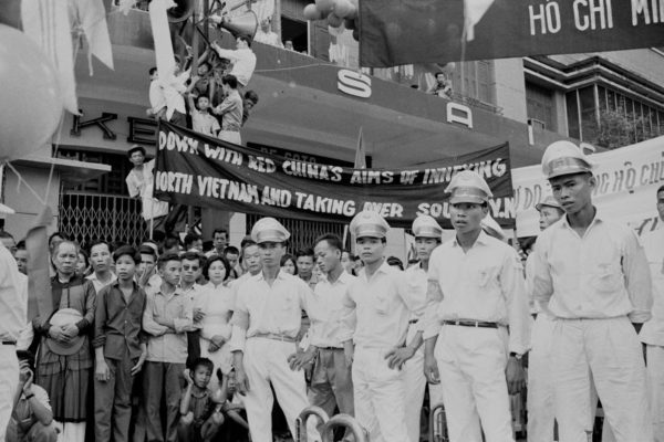 Anti-Communist Students demonstrating in Saigon (Ho Chi Minh City) on the 10th anniversary of the 1954 Geneva accords, South Vietnam, July 1964. A banner reads 'Down with Red China's Aims of Innexing North Vietnam and Taking Over South V.N.' (sic). (Photo by Nguyen Van Duc/Michael Ochs Archives/Getty Images)