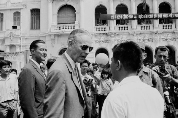 US Army officer and diplomat Maxwell Davenport Taylor (1901 - 1987, centre), the US Ambassador to South Vietnam, at a student protest on the 10th anniversary of the 1954 Geneva accords in Saigon (Ho Chi Minh City) in South Vietnam, July 1964.   (Photo by Nguyen Van Duc/Michael Ochs Archives/Getty Images)