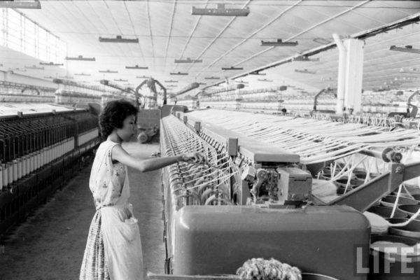 saigon-1961---south-vietnamese-woman-checking-the-machines-in-a-textile-mill_5382468147_o
